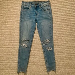 American Eagle Super Skinny high-rise distressed light wash jeans, size 6
